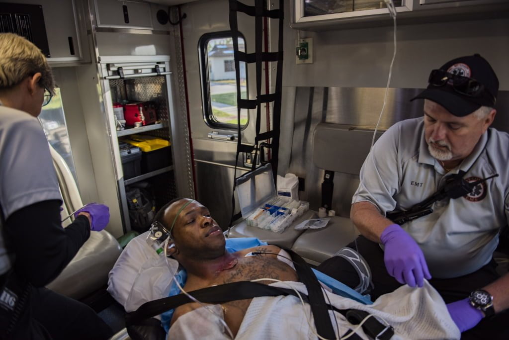 A patient in the back of an ambulance during a training drill.