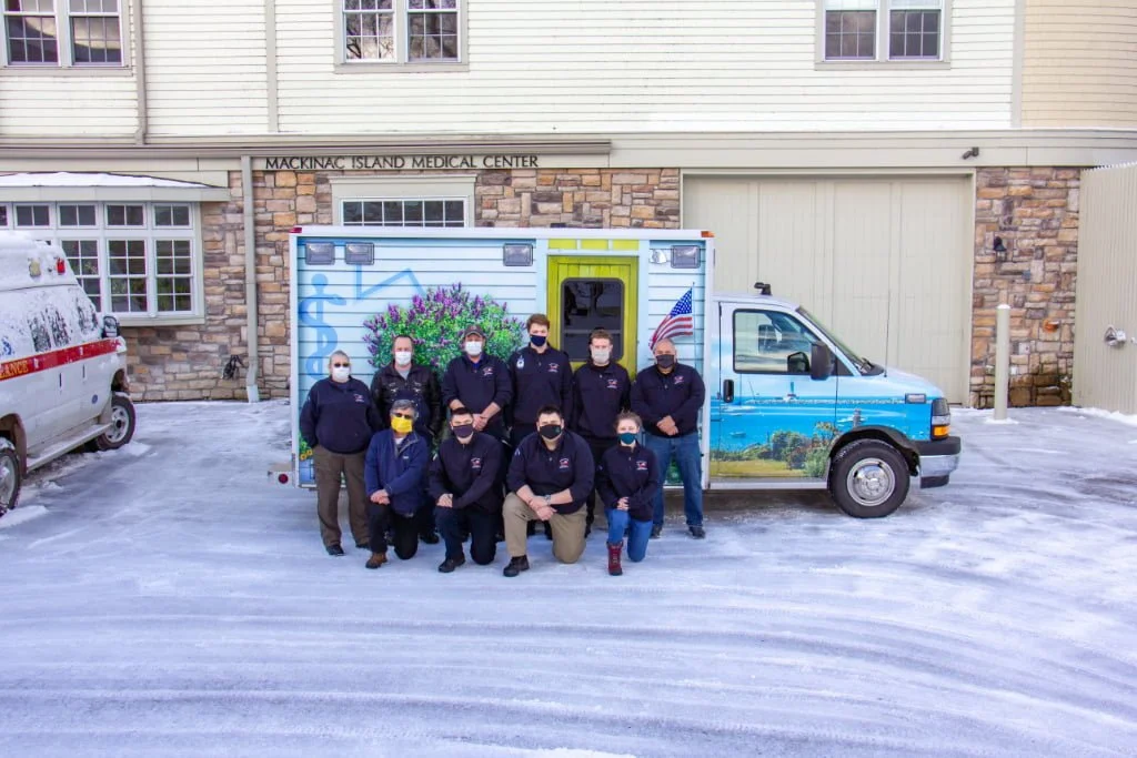 Mackinac Island EMS paramedics and emergency medical technicians pose with their new rig.
