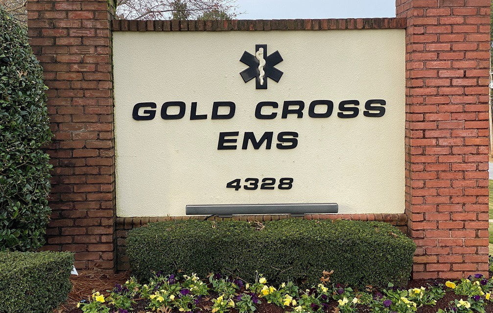 A Gold Cross EMS sign.
