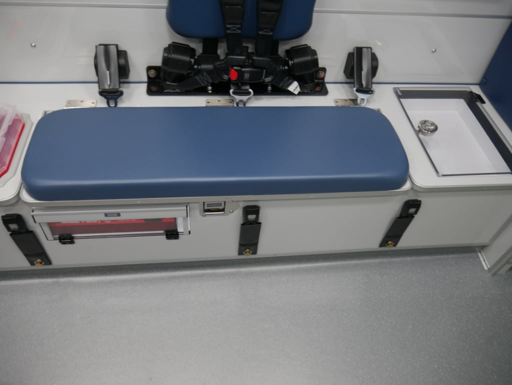 The rig's squad bench has a single seating position that is protected by a Per4max four-point harness system, as are the other seating positions in the patient module.