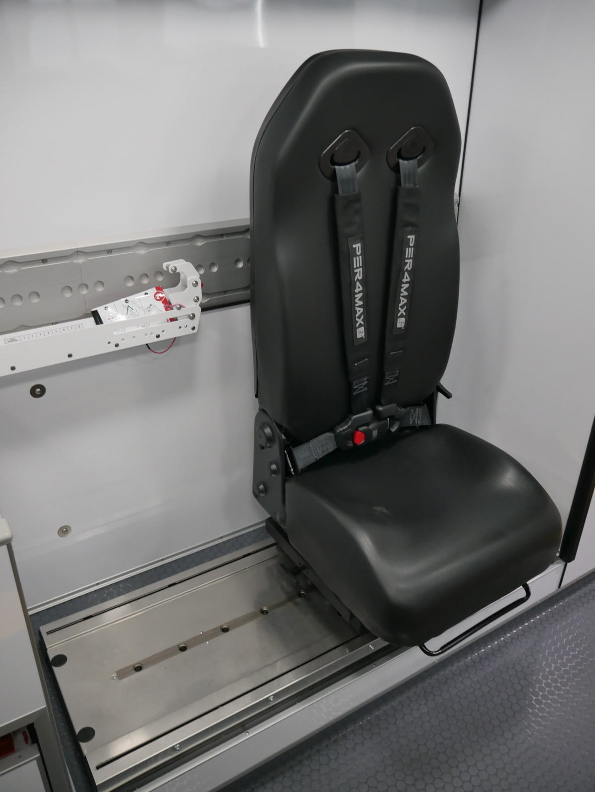 Cambridge wanted the ability to carry two patients, so it had AEV install a sliding and swiveling captain's chair that can be folded flat on the curb side of the patient module, with Ferno INTRAXX fixtures on the wall designed to hold rotating arms that can mount a backboard and military style litter.