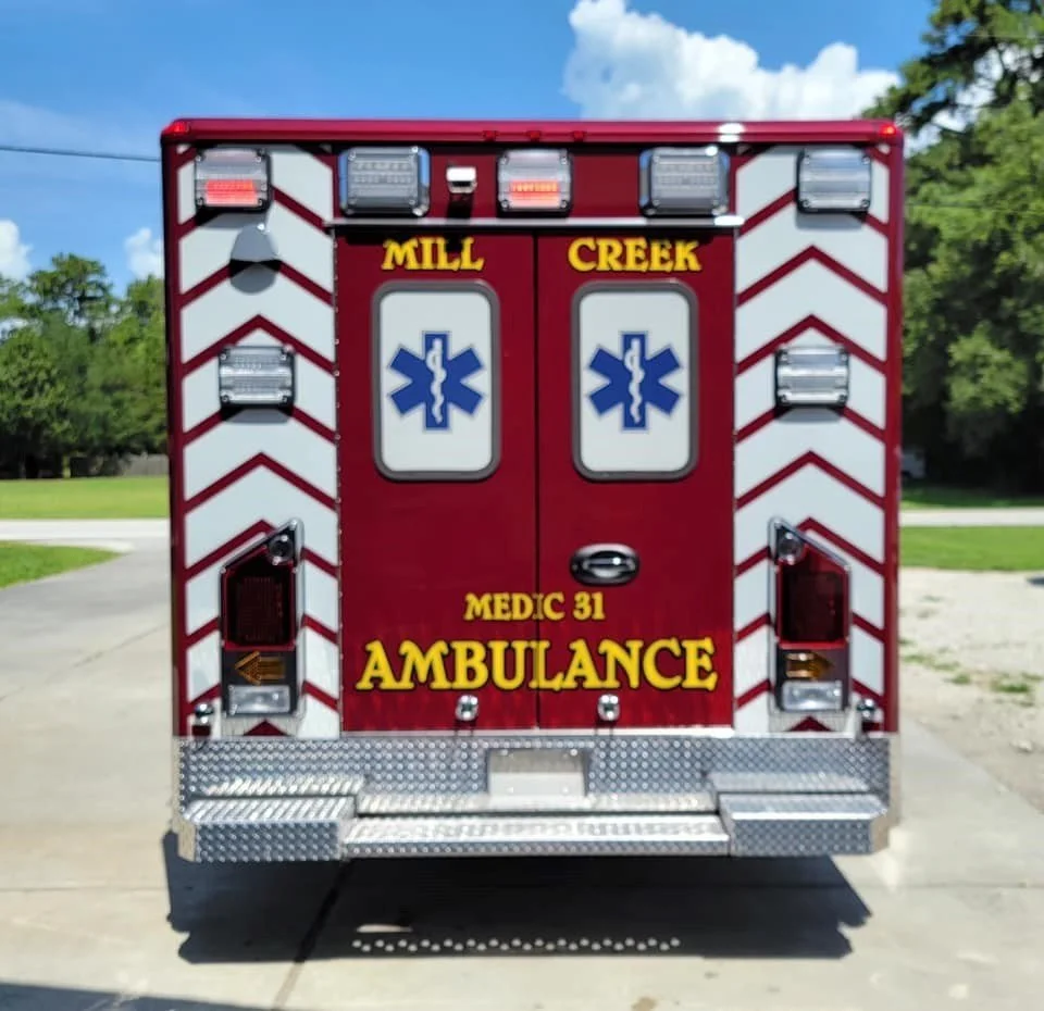 The rear of the Mill Creek Type 3 has custom chevron striping, and a notched kick-plate under-ride rear bumper.