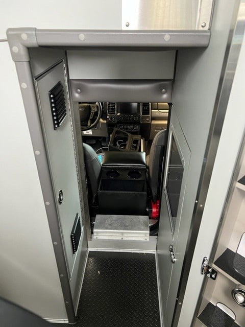 The new AEV rigs for Sedgwick County have a crawl-through opening between the patient box and the cab.
