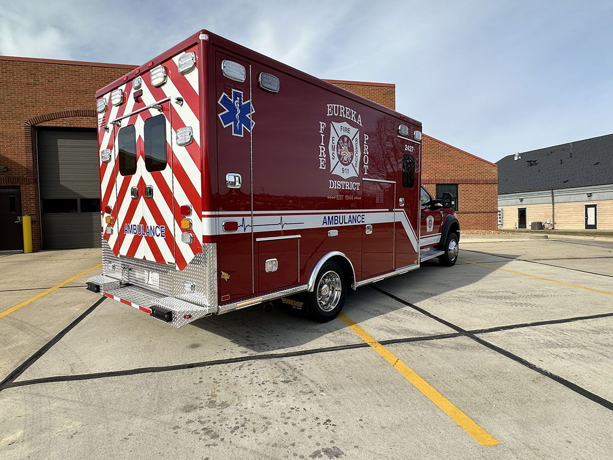 The passenger side and the rear of the ambulance is shown.