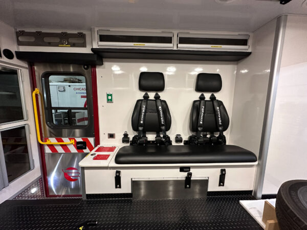 The squad bench has two seating positions. All seats in the back of the rig are protected by Per4Max four-point harnesses.