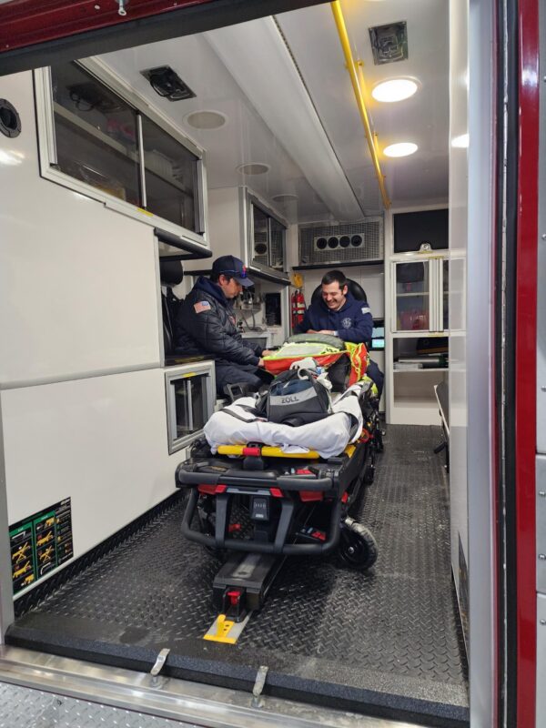 Lansing firefighter/medics secure the Stryker PowerLOAD cot in the rear of the rig. (Photo 7 courtesy of Lansing Fire Department)