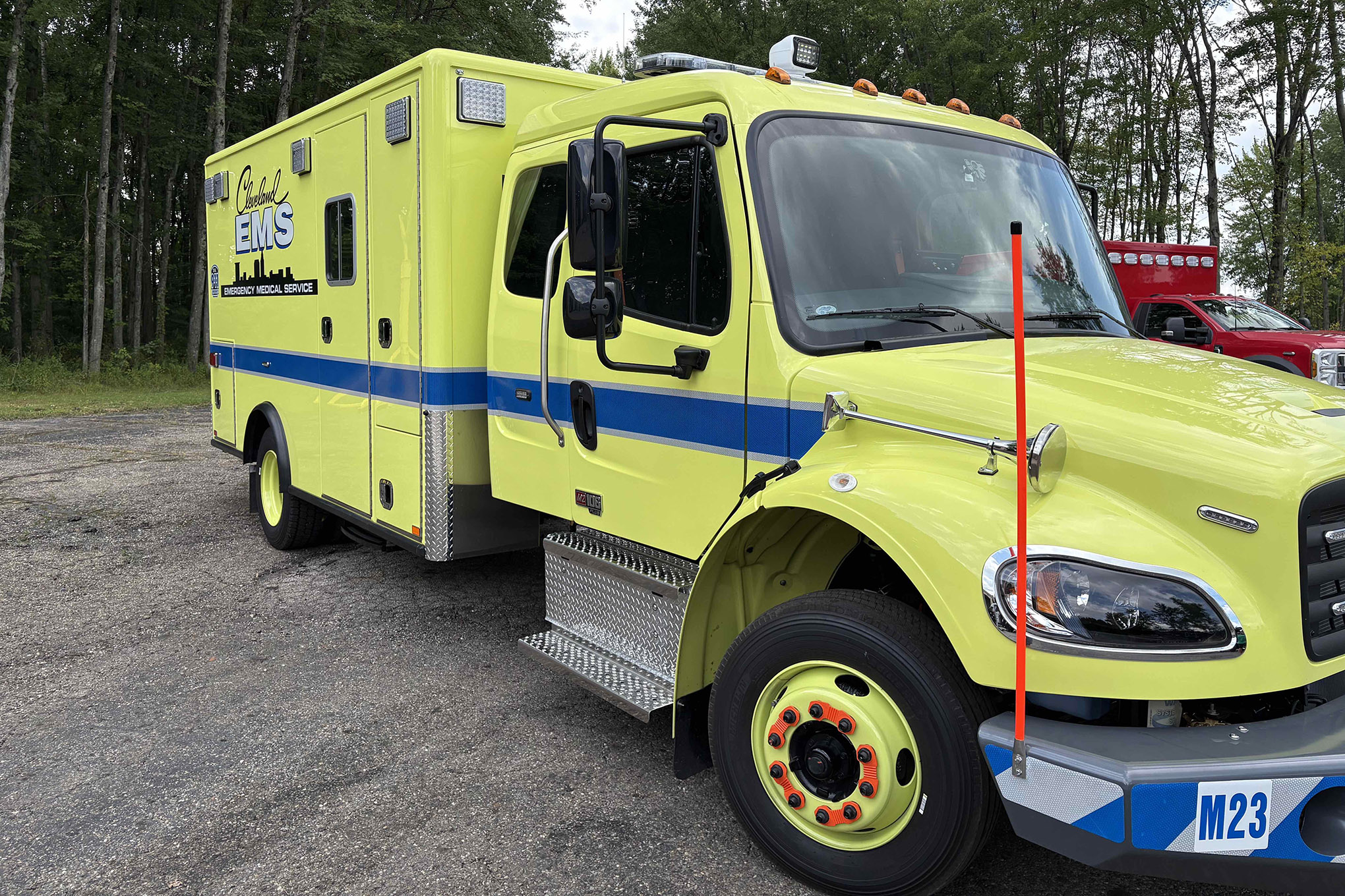 Front-corner view of the new Horton Emergency Vehicles Type 1 ambulance for Cleveland (OH) EMS. It has a Golight LED remote-control spotlight on top of the cab.
